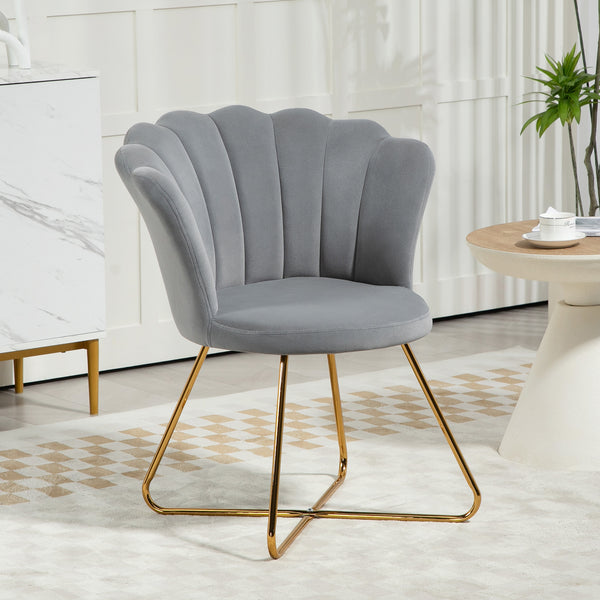 Poltroncina grigia effetto velluto con schienale a conchiglia